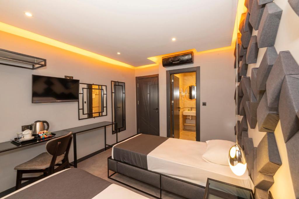 Postel nebo postele na pokoji v ubytování White Palace Hotel