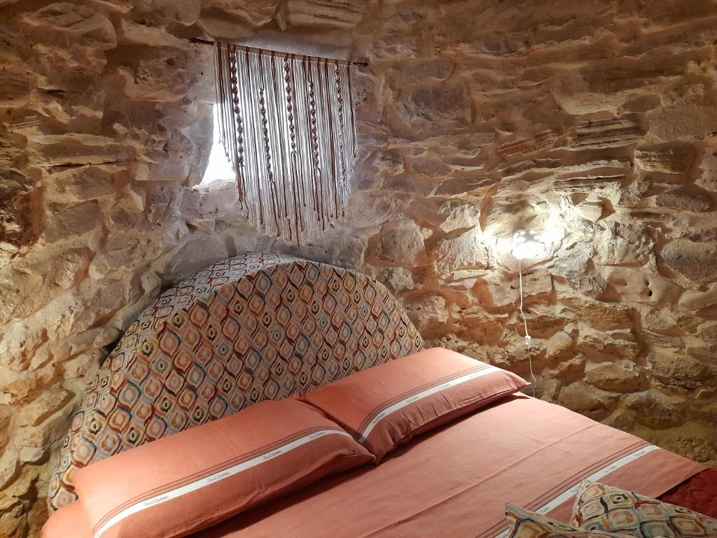 Posteľ alebo postele v izbe v ubytovaní Trullo "Il fico d'india"