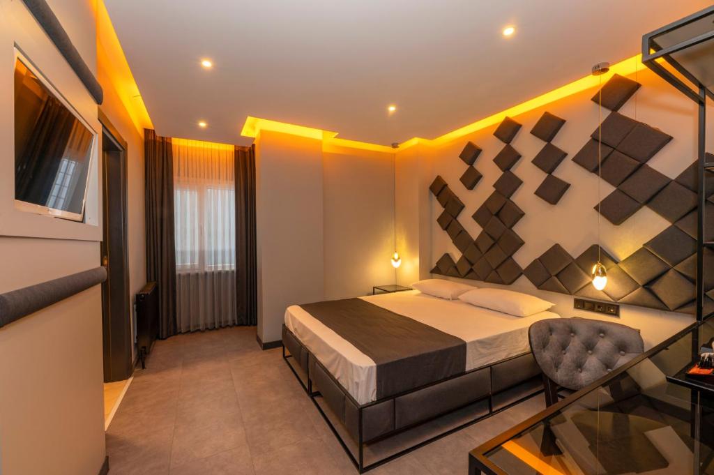 Postel nebo postele na pokoji v ubytování White Palace Hotel