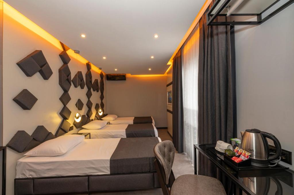 Postel nebo postele na pokoji v ubytování White Palace Hotel