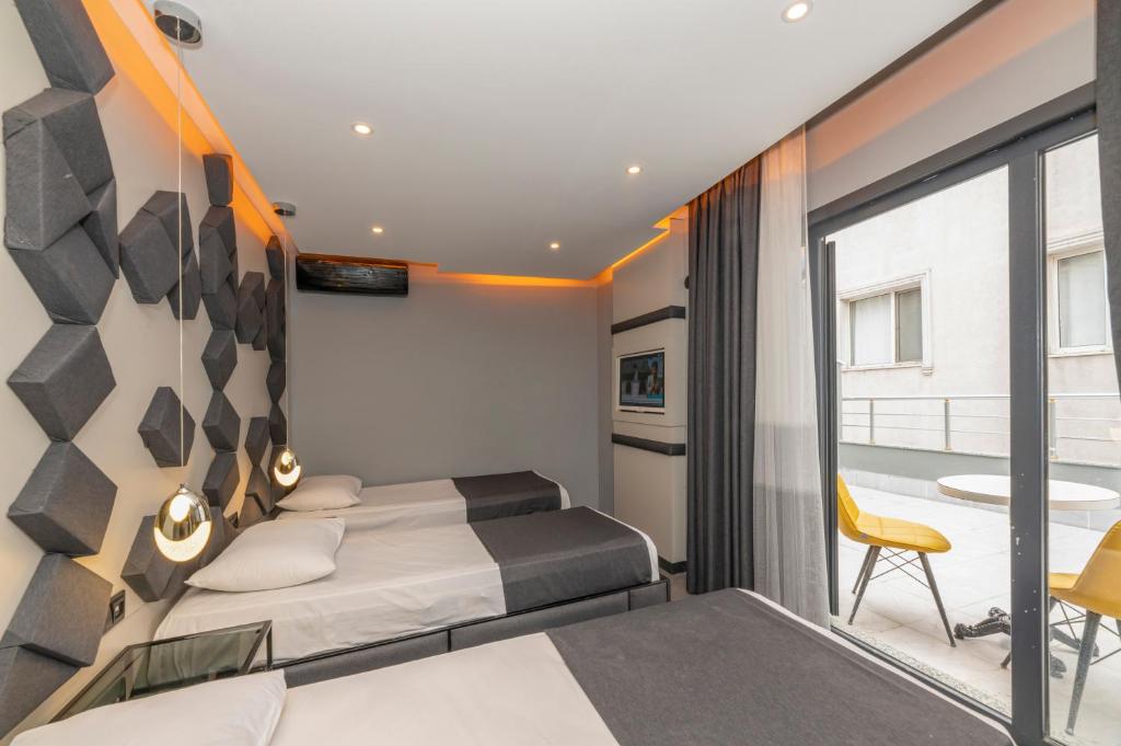 Postel nebo postele na pokoji v ubytování White Palace Hotel