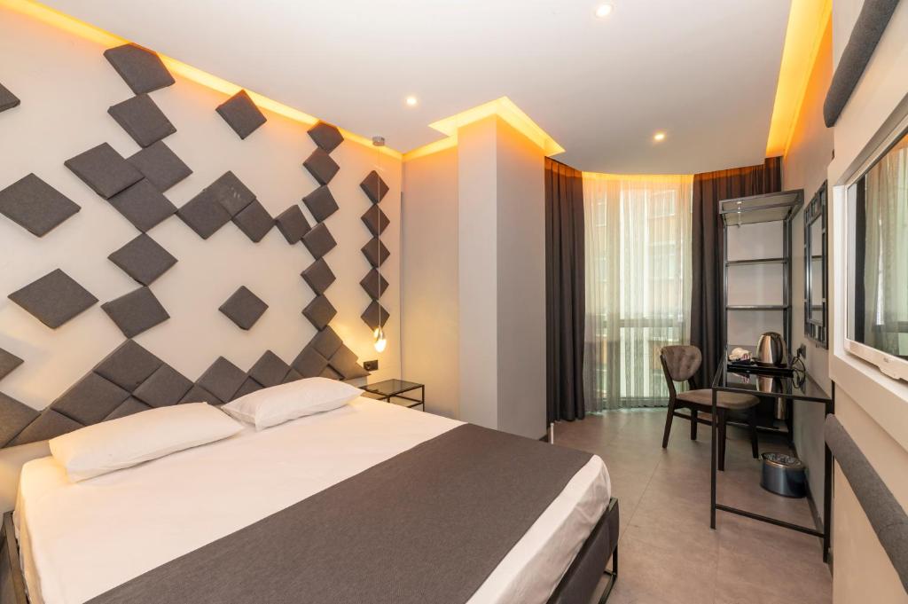 Postel nebo postele na pokoji v ubytování White Palace Hotel