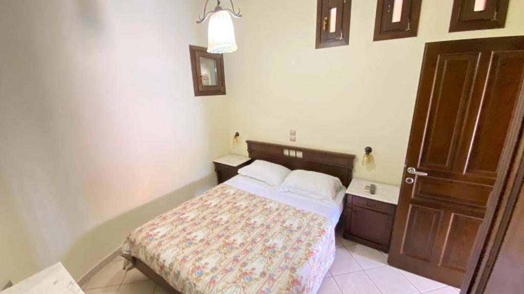Łóżko lub łóżka w pokoju w obiekcie Klelia Hotel