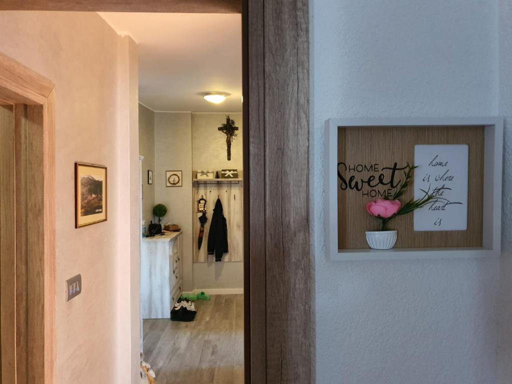 a hallway with a picture of a flower on the wall at Apartment Sara in Umag