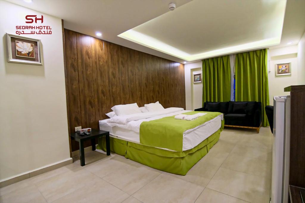 Postel nebo postele na pokoji v ubytování Sedrah Hotel