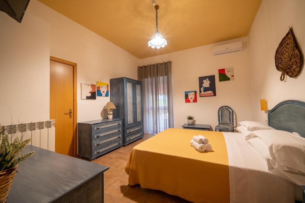 Postel nebo postele na pokoji v ubytování Hotel Costa D'Oro