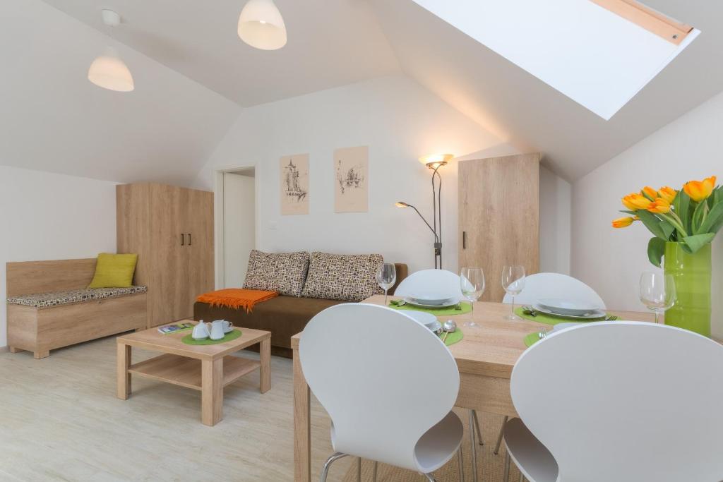 a living room with a table and a couch at OLD TOWN Apartments in Ljubljana