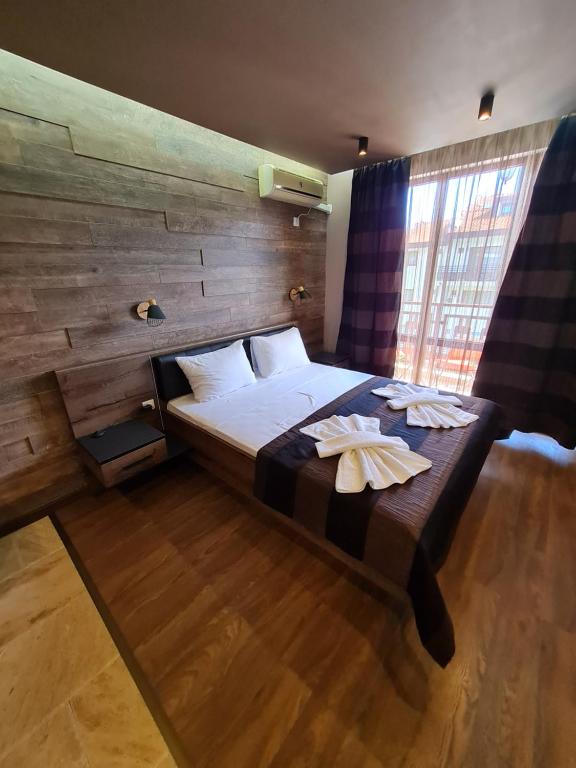 Postel nebo postele na pokoji v ubytování MitProt luks studio Panorama Bay 2 ap.105