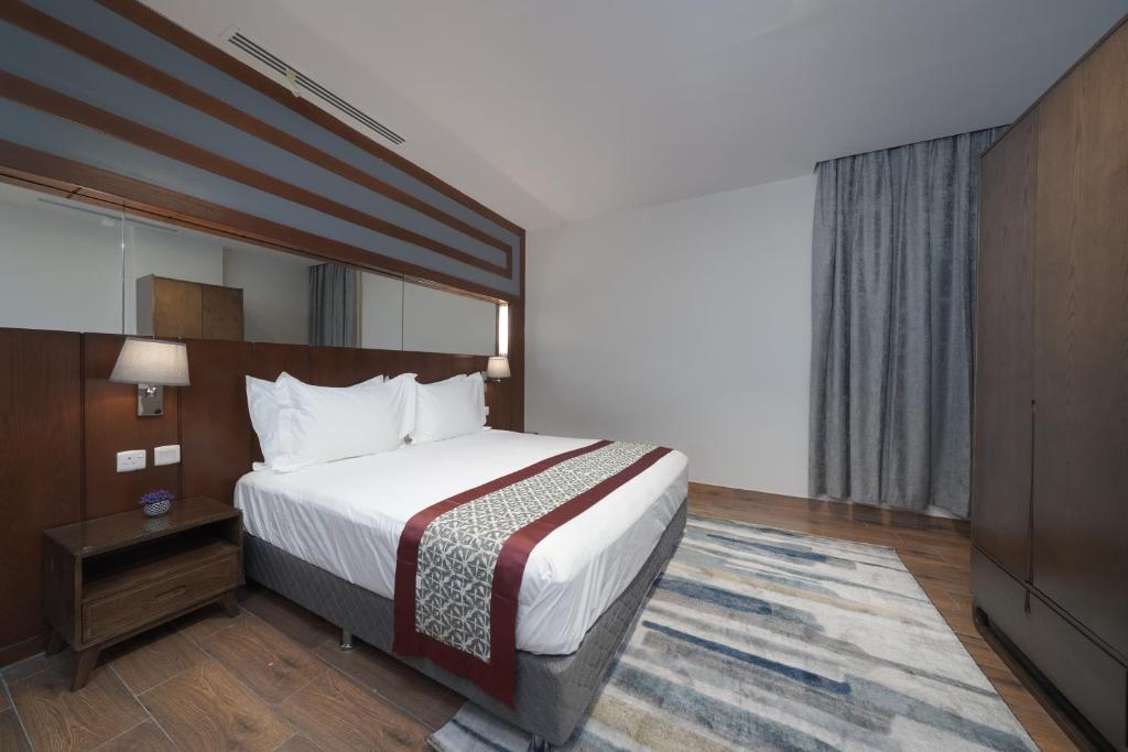 Postel nebo postele na pokoji v ubytování Biz Hotel Apartments