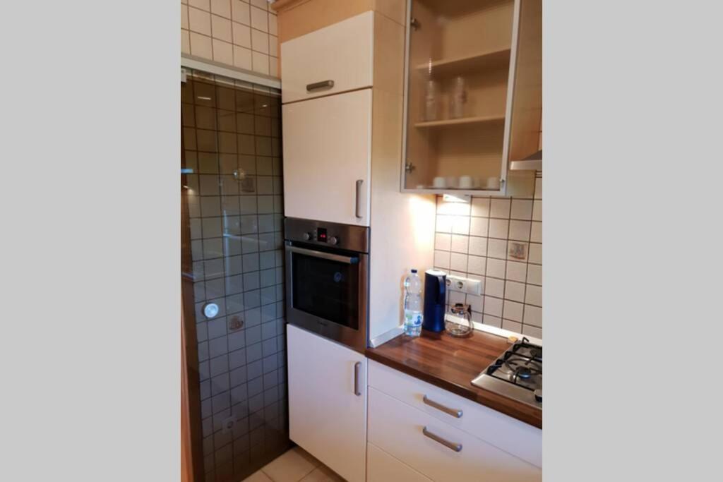 Kuchyň nebo kuchyňský kout v ubytování The Pearl of the Danube Bend - Regina Apartman