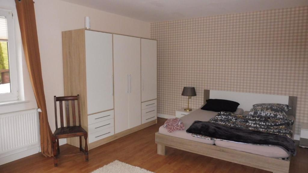 Postel nebo postele na pokoji v ubytování Zimmer 4 + 5 zusammen gemietet ein Apartment