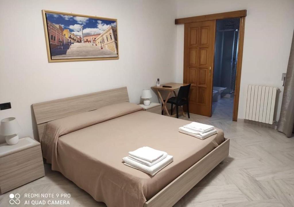 Posteľ alebo postele v izbe v ubytovaní B&B Annunziata