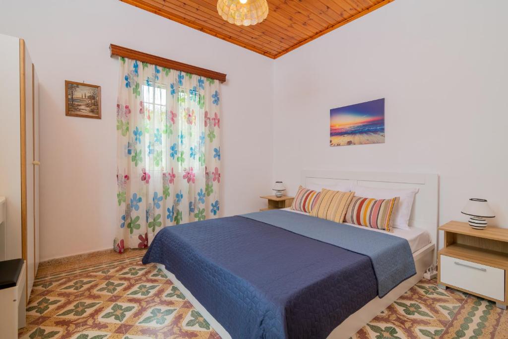 Postel nebo postele na pokoji v ubytování Avrochares Villa