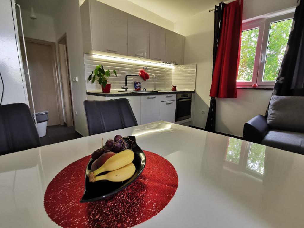 Kuchyň nebo kuchyňský kout v ubytování Apartment Adriana