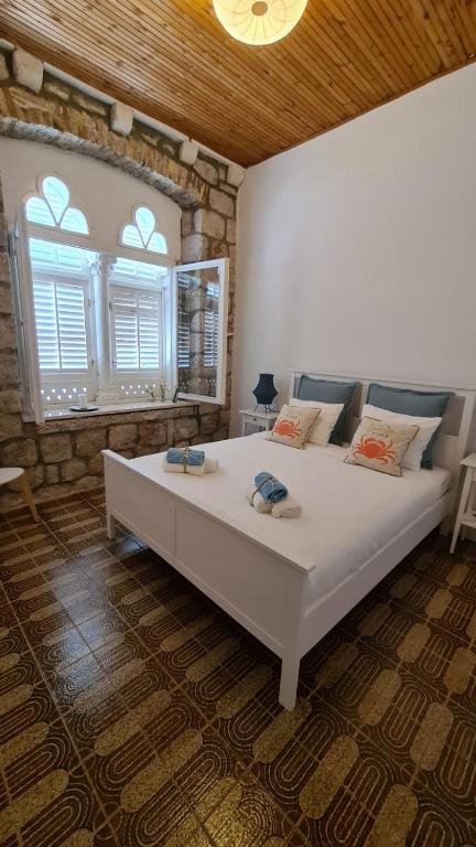 Posteľ alebo postele v izbe v ubytovaní Beach front AmF Holiday Home