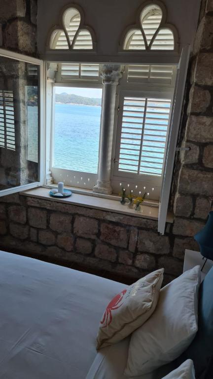 Posteľ alebo postele v izbe v ubytovaní Beach front AmF Holiday Home