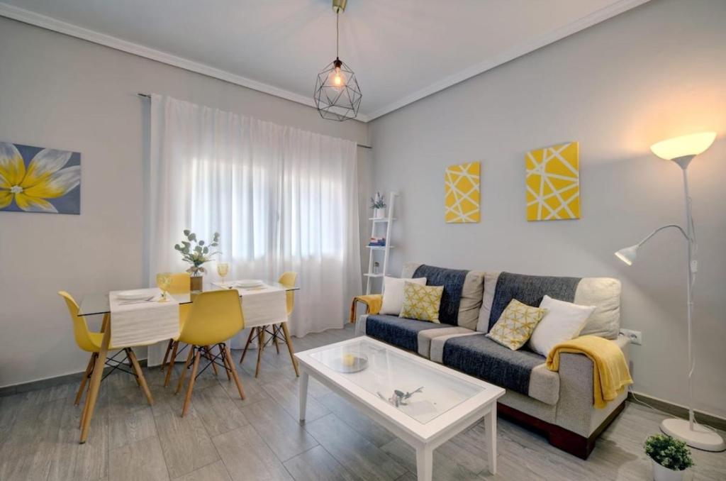 a living room with a couch and a table at 13 Avenida Andalucía in Ronda