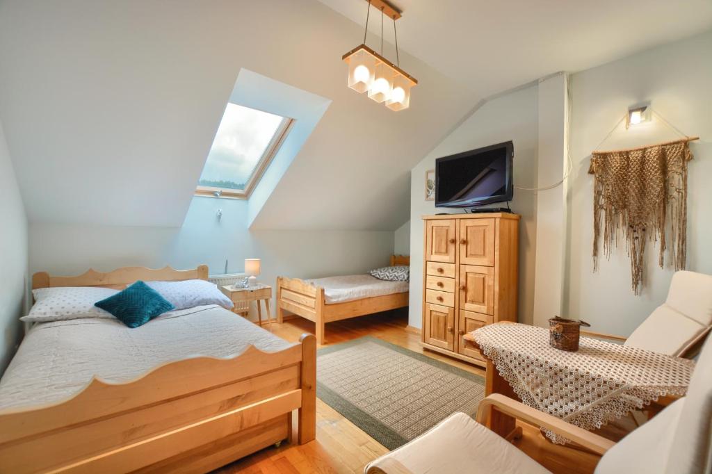 Posteľ alebo postele v izbe v ubytovaní Apartamenty BIESZCZADZKI Anioł