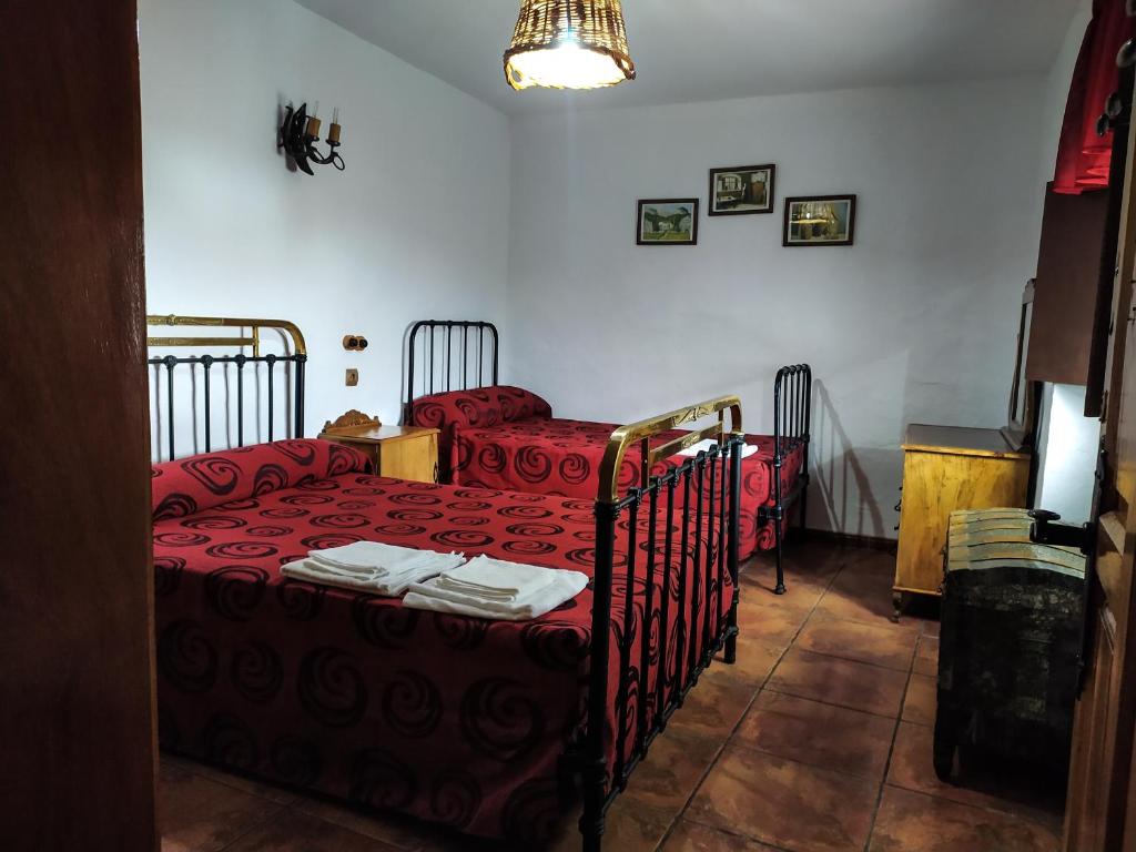 Postel nebo postele na pokoji v ubytování Alojamiento Rural Mendoza