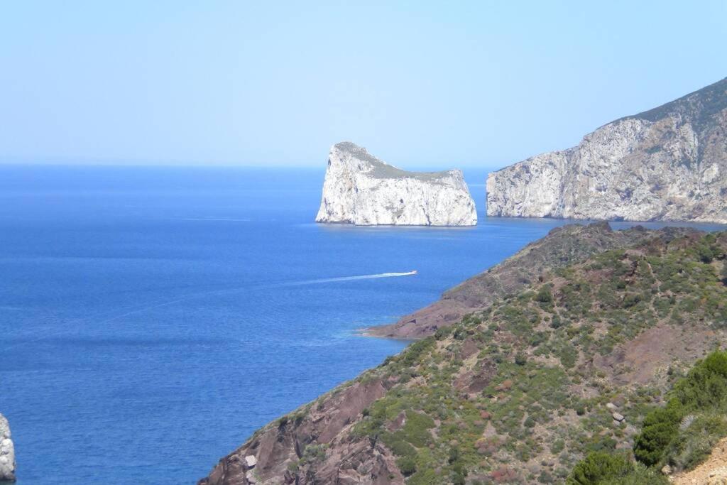 a view of the ocean with white cliffs at Villa sul mare panorama unico in Nebida