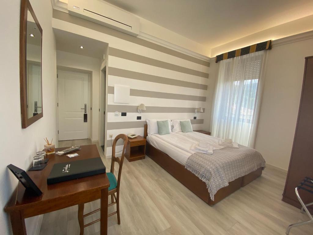 Postel nebo postele na pokoji v ubytování Hotel La Fontana