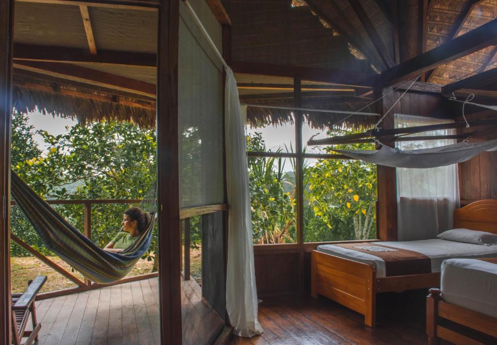 Postel nebo postele na pokoji v ubytování Wasai Tambopata Lodge