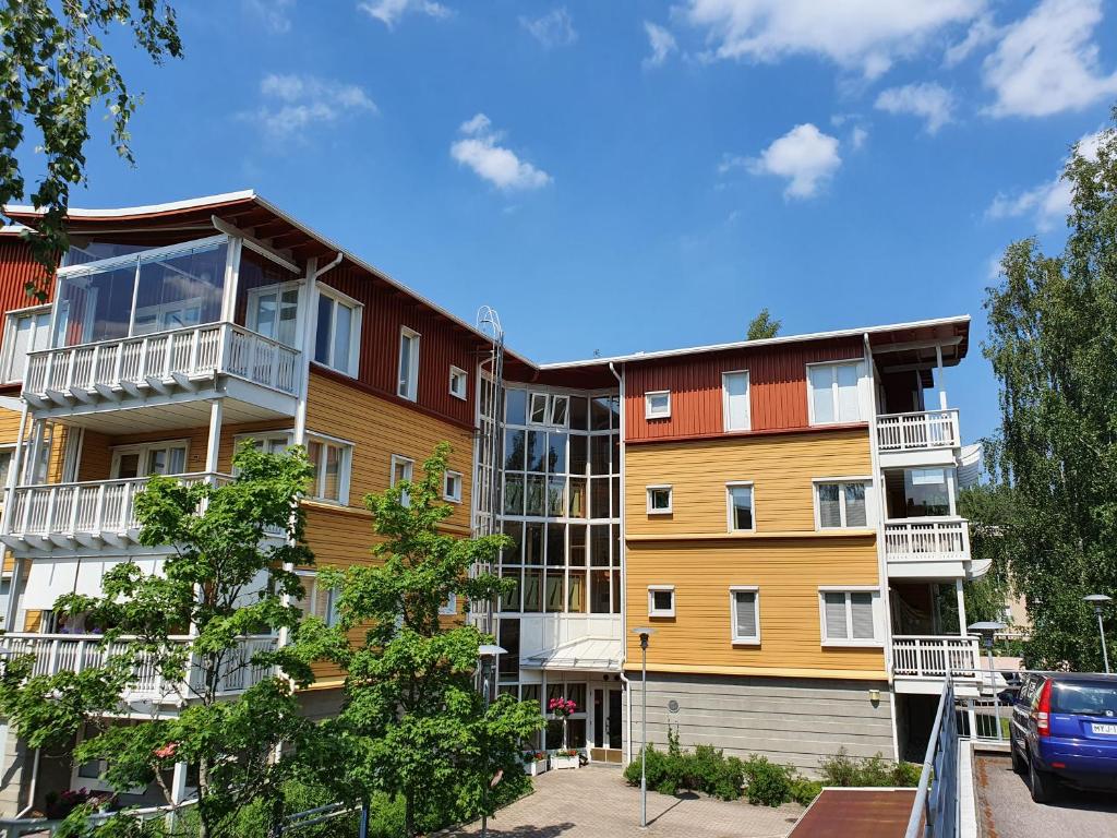 a building with balconies on the side of it at Pinjakoti in Lahti