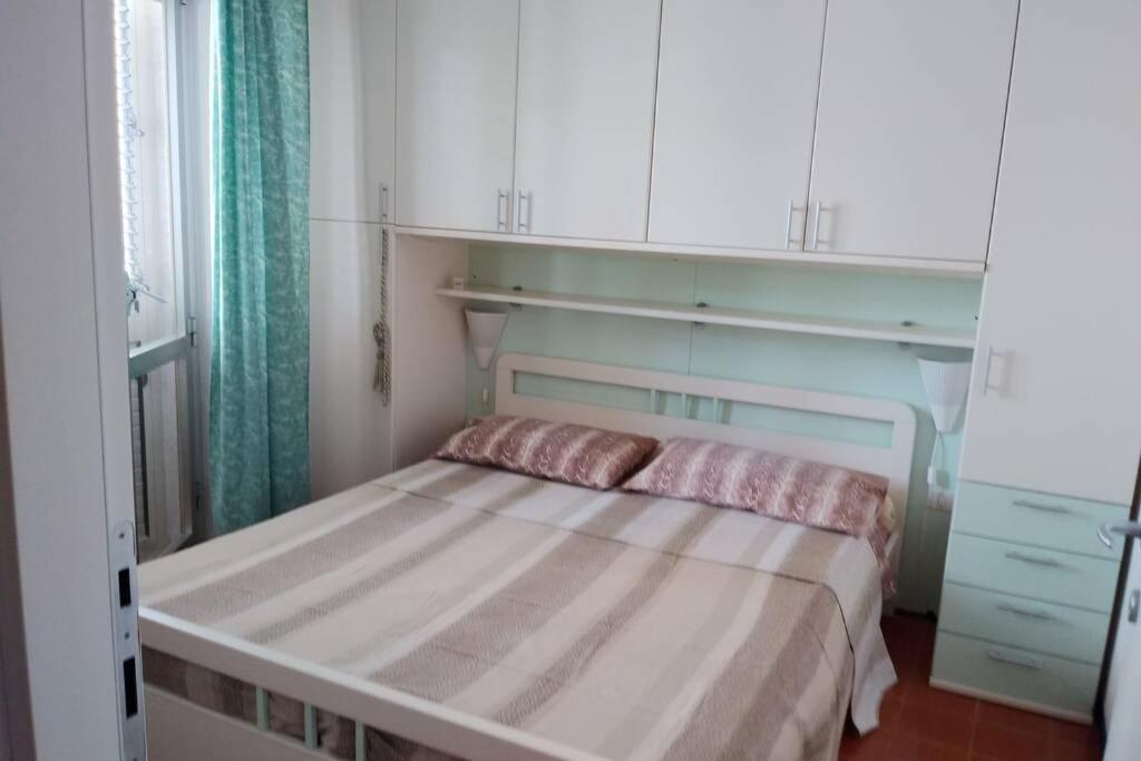 A bed or beds in a room at Casa al mare ingresso indipendente