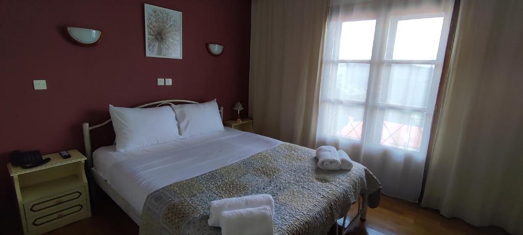 Posteľ alebo postele v izbe v ubytovaní Hotel Mitikas