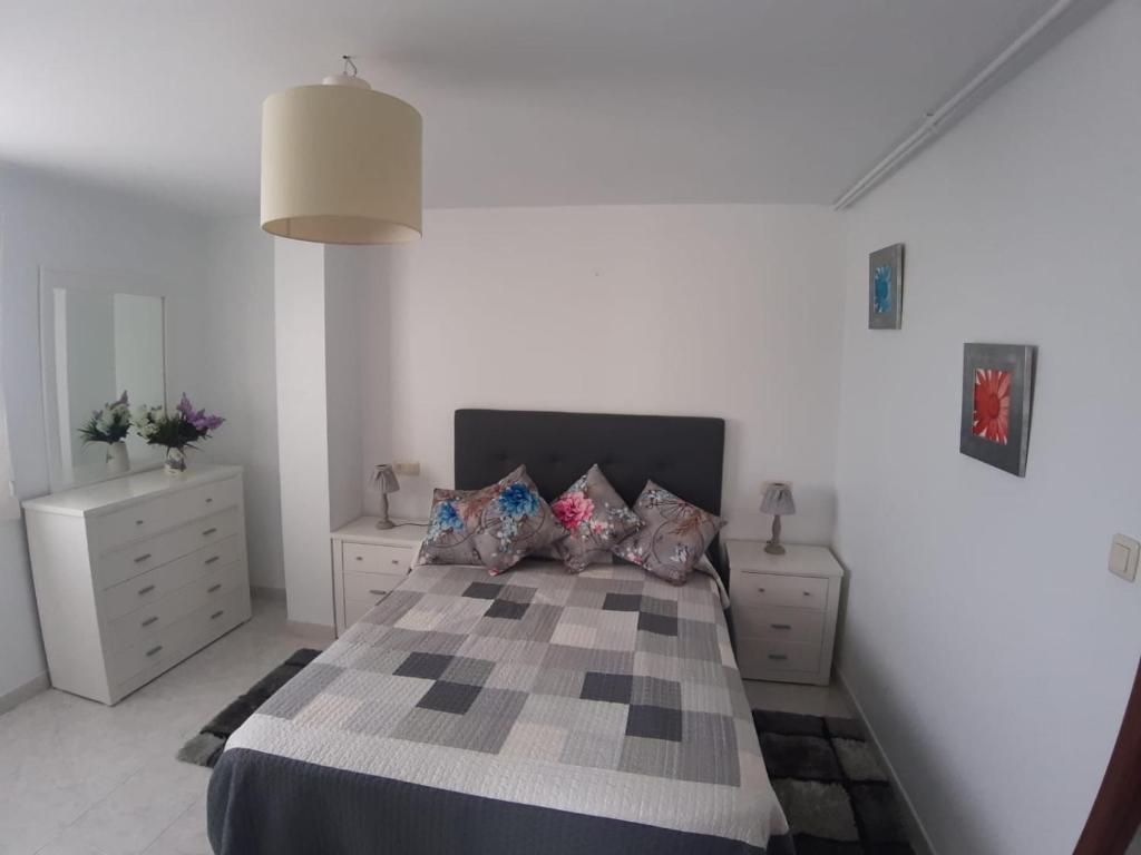 A bed or beds in a room at Area Pequena