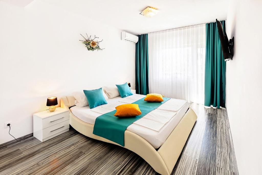 Ένα ή περισσότερα κρεβάτια σε δωμάτιο στο Vila Mosel