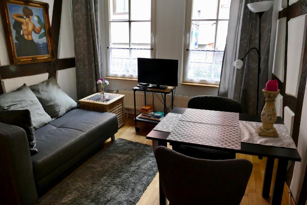 a living room with a couch and a table at Ad Monte in Cochem