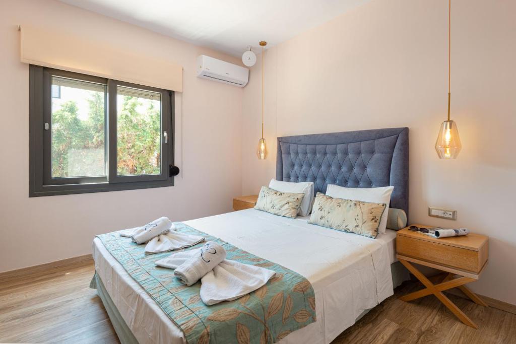 Postel nebo postele na pokoji v ubytování Regos Resort Hotel