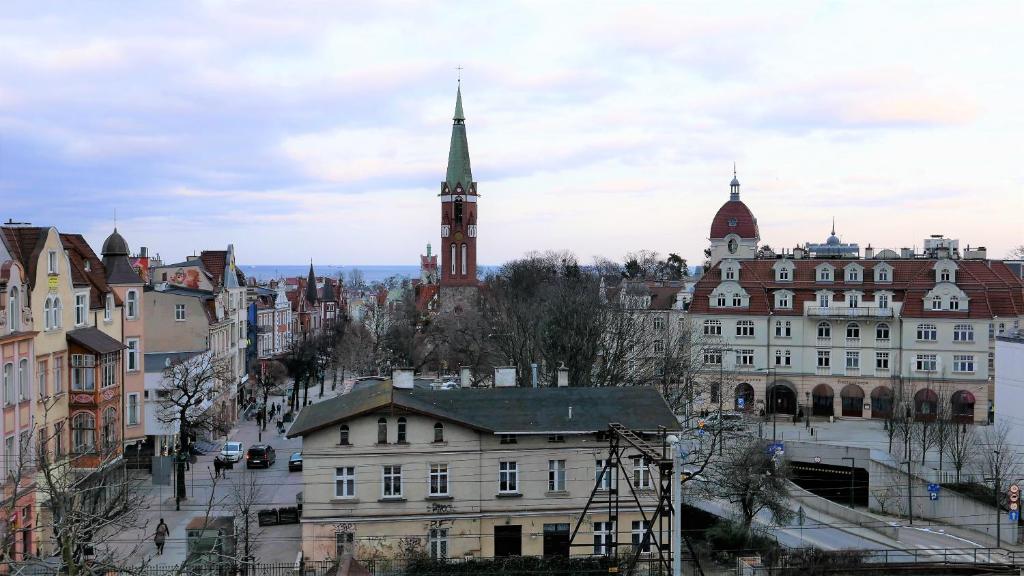 a view of a city with a clock tower at Vintageapartment in Sopot
