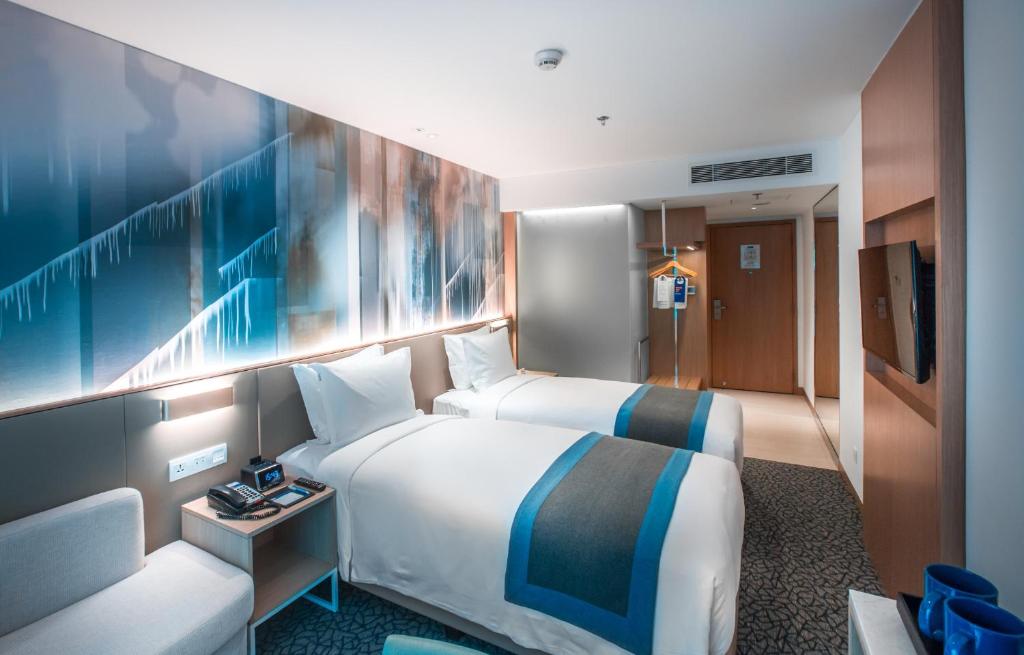 Postel nebo postele na pokoji v ubytování Holiday Inn Express Manila Newport City by IHG