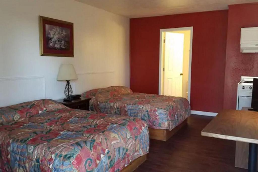 Ένα ή περισσότερα κρεβάτια σε δωμάτιο στο Unity Lodge