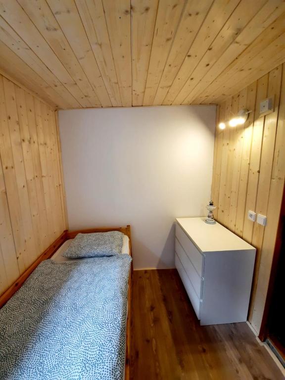 Postel nebo postele na pokoji v ubytování Malovaný sklípek
