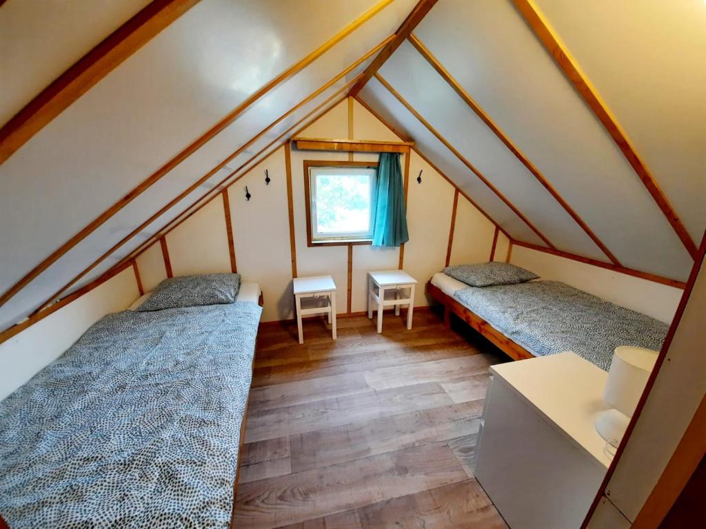 Postel nebo postele na pokoji v ubytování Malovaný sklípek