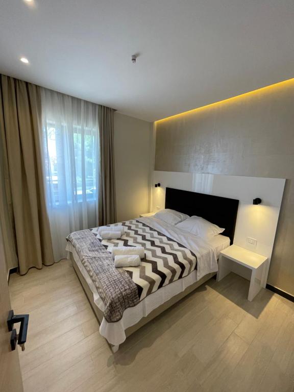 Un pat sau paturi într-o cameră la Meudsa Grand Agia Triada