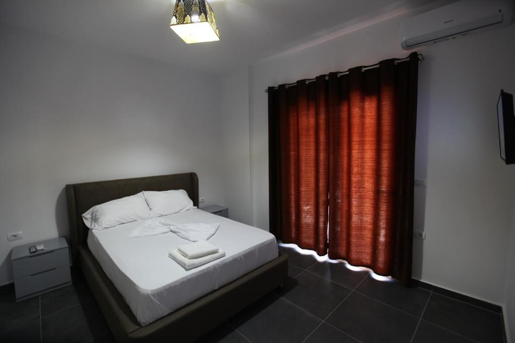 Postel nebo postele na pokoji v ubytování Deda Apartments