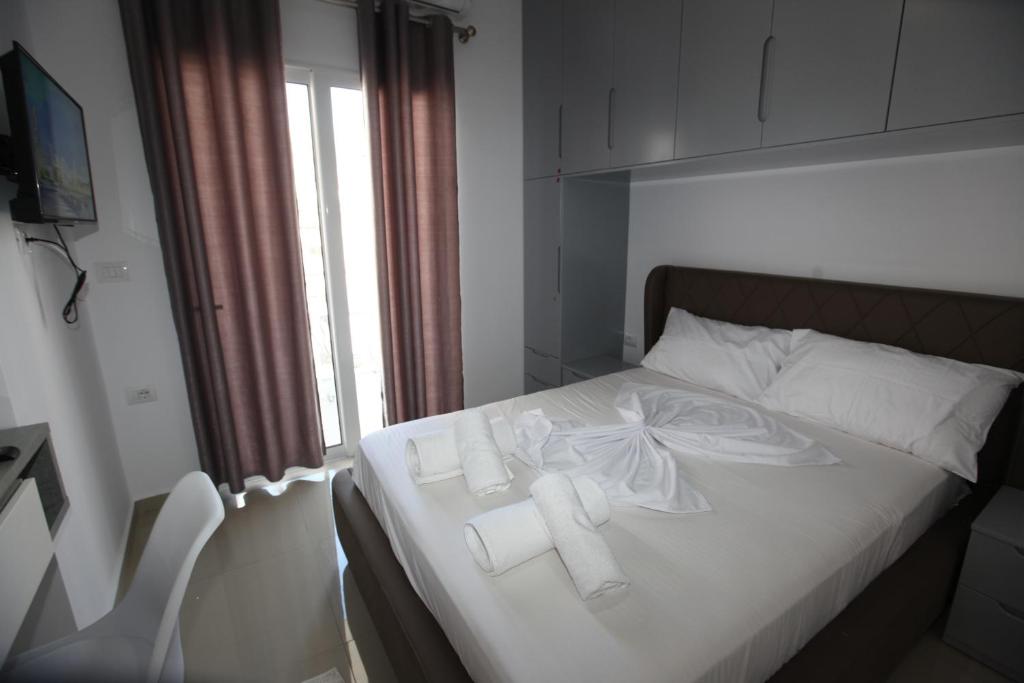 Postel nebo postele na pokoji v ubytování Deda Apartments