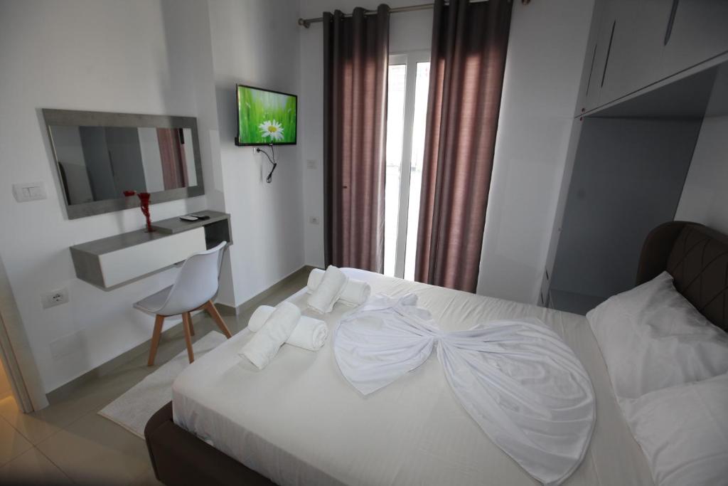 Postel nebo postele na pokoji v ubytování Deda Apartments