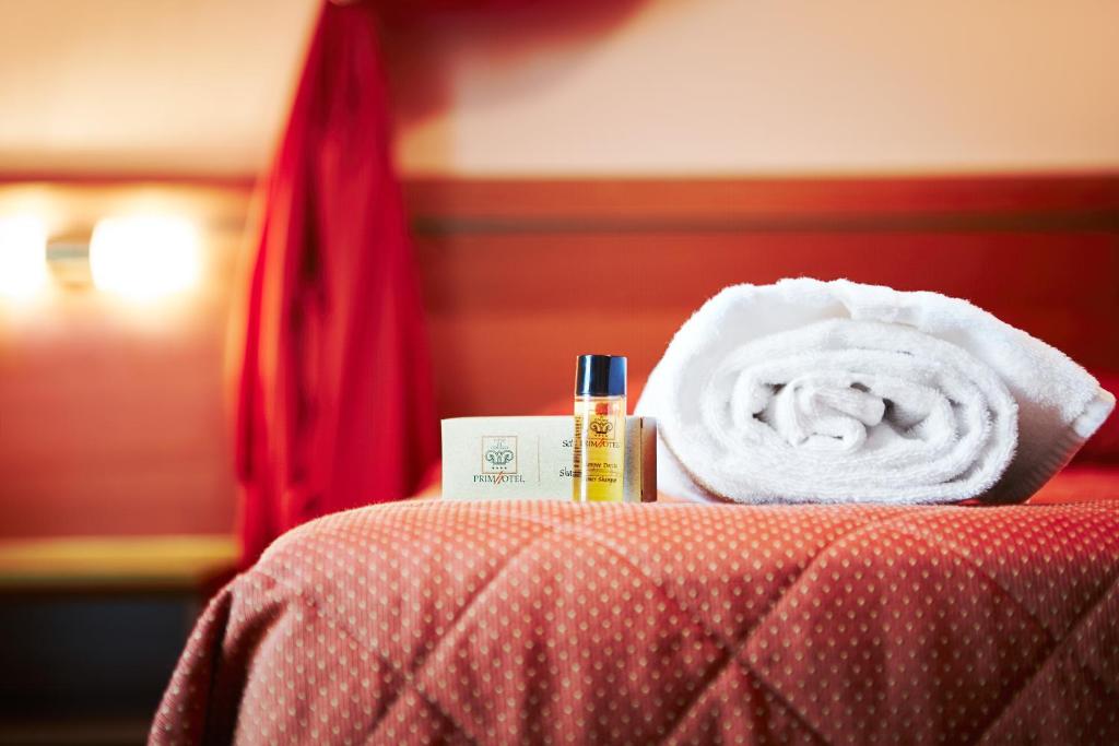 Postel nebo postele na pokoji v ubytování Primhotel