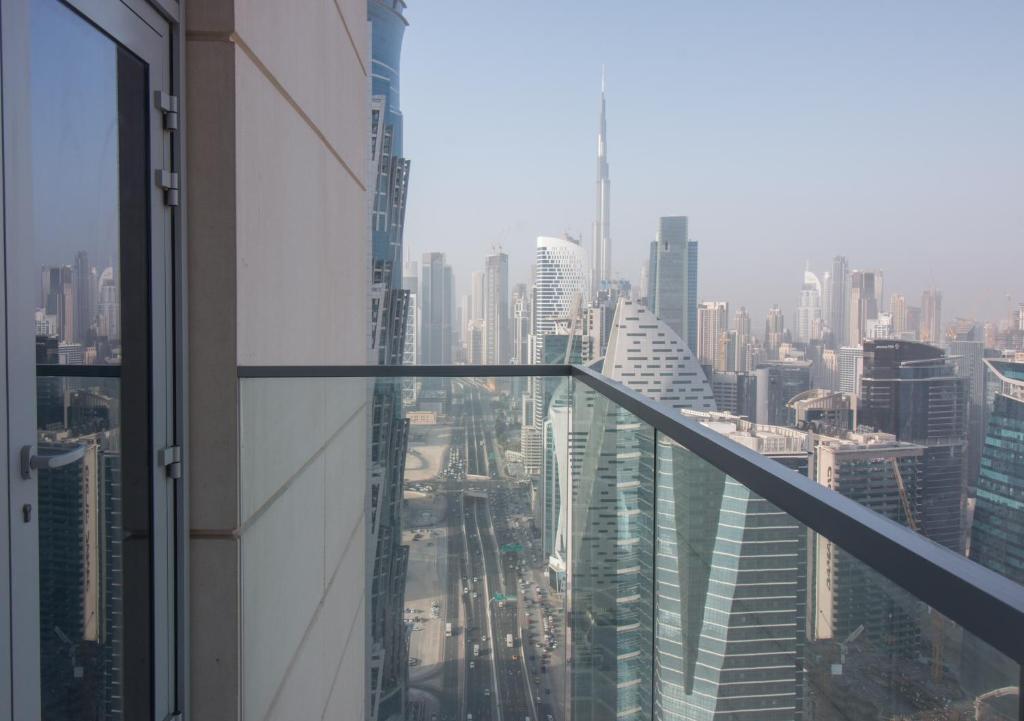 a view of a city from the top of a skyscraper at Burj Khalifa view from ALL rooms Brand New 3BR - Noora in Dubai