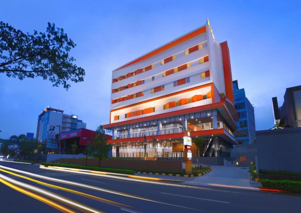 a building on the side of a city street at Starlet Hotel BSD City in Tangerang