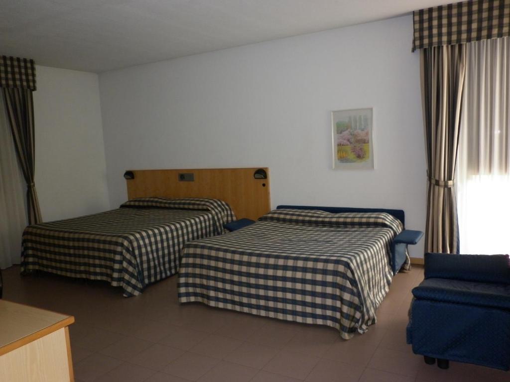 Postel nebo postele na pokoji v ubytování Hotel Aurora