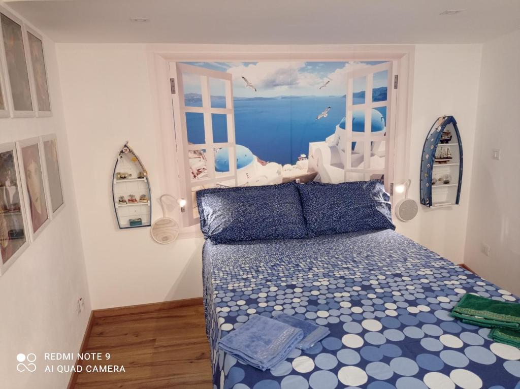 A bed or beds in a room at Casa Titanic Siracusa