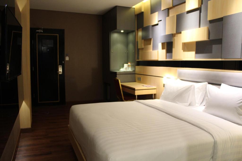 Voodi või voodid majutusasutuse Shakti Hotel Bandung toas