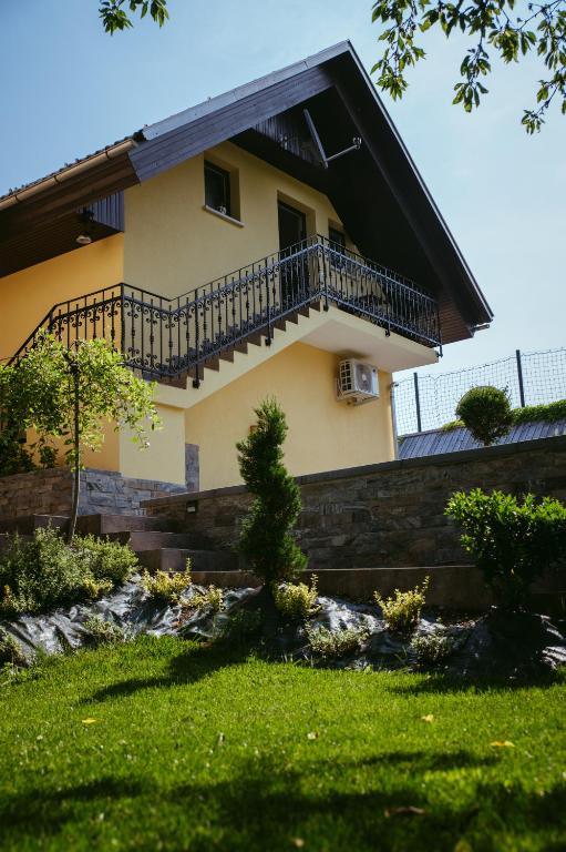 a house with a balcony on the side of it at Apartment Oddih in Bled