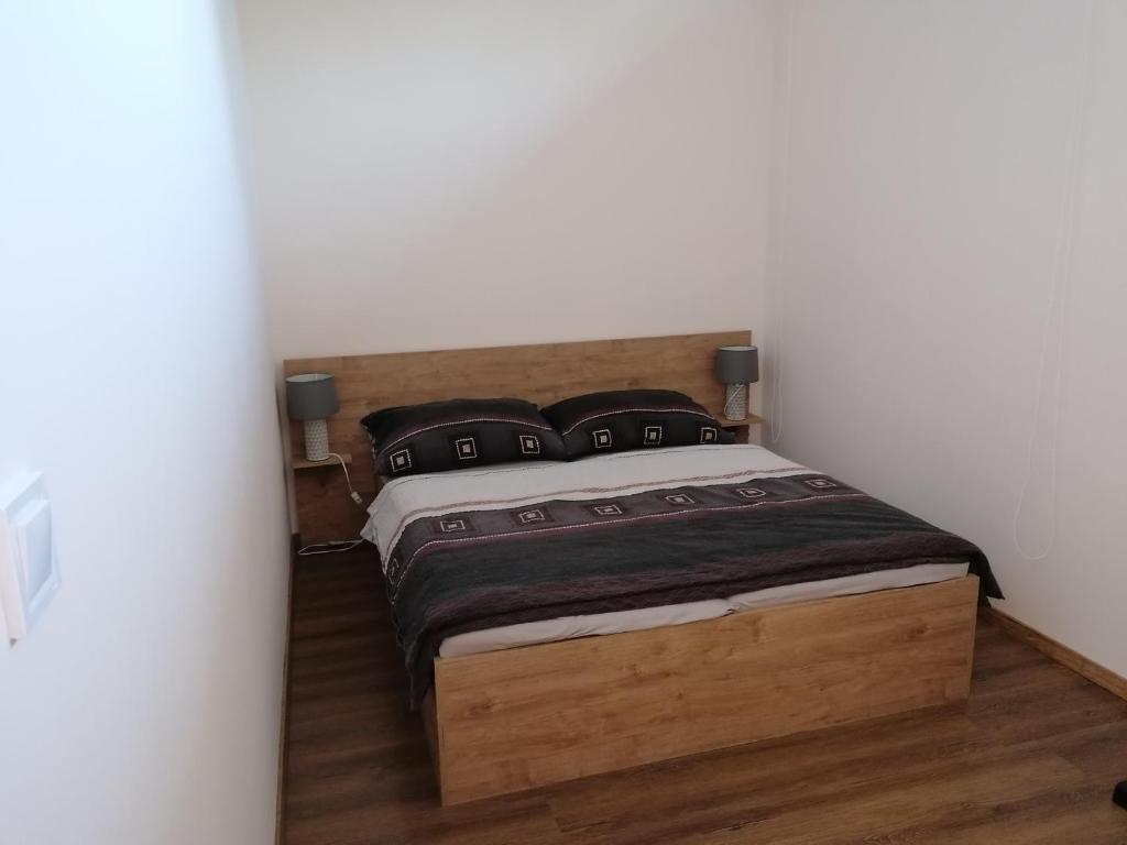 Postel nebo postele na pokoji v ubytování K-plus penzión